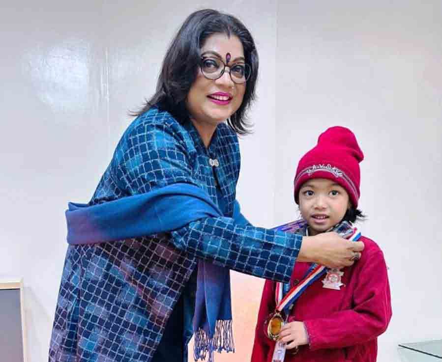 Principal Honours Xianna for Outstanding Swimming Achievement