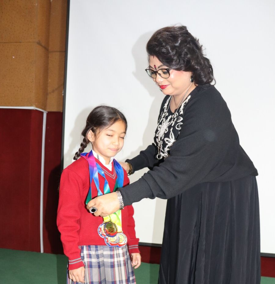Principal Honours Xianna for Outstanding Swimming Achievement